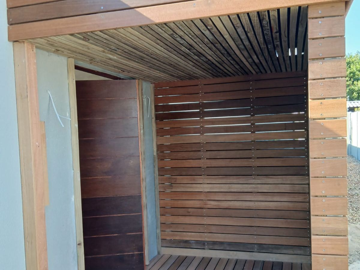Timber-clad balcony deck rebuilt over a waterproofed slab